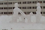 Snow men in front of school